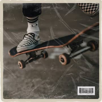 DOWNHILL cover: a skateboard and checkered sneaker on a dusty ground